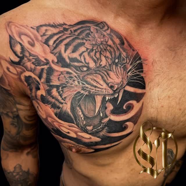 Ferocious tiger head in bold black-and-gray shading.