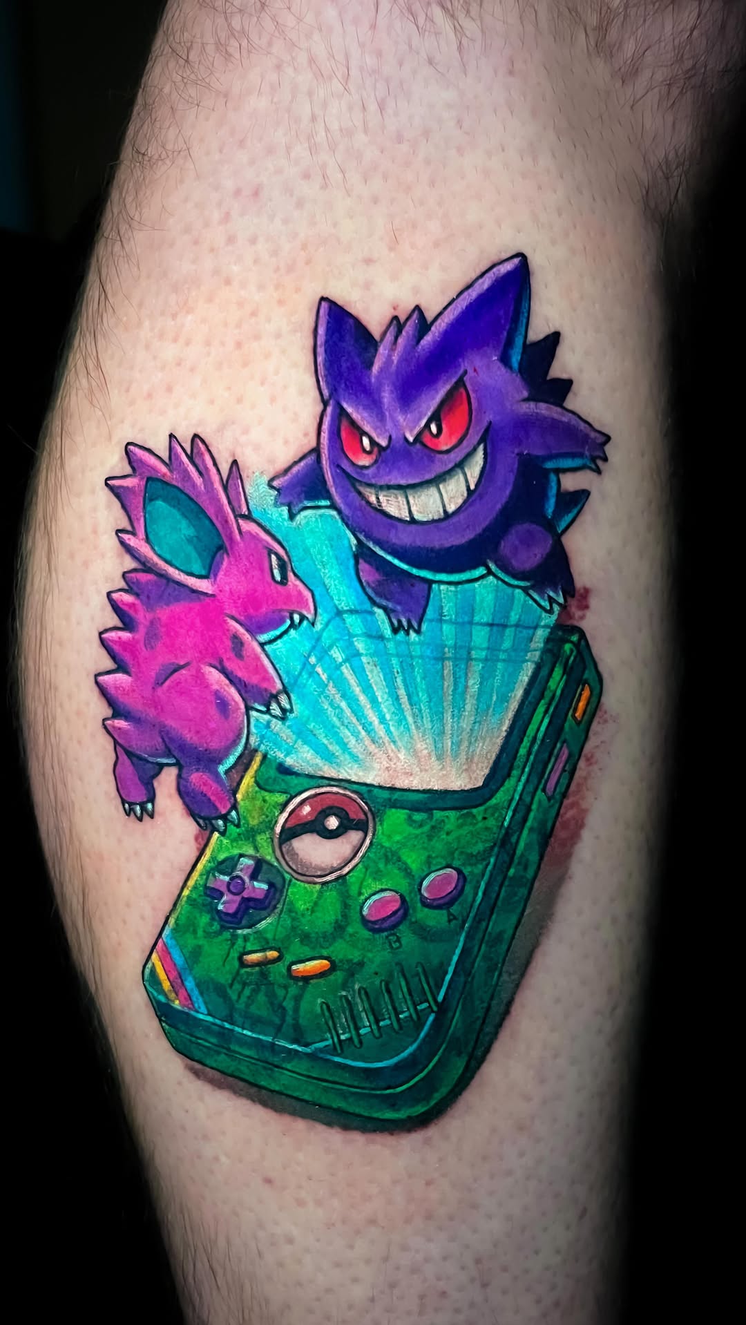 Vibrant retro Game Boy tattoo bursting with Gengar and Nidorino