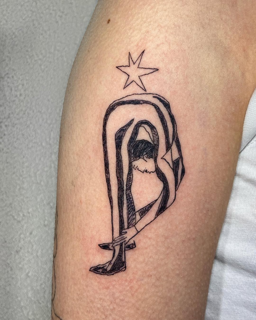 Minimalist contortionist within arched frame, star overhead