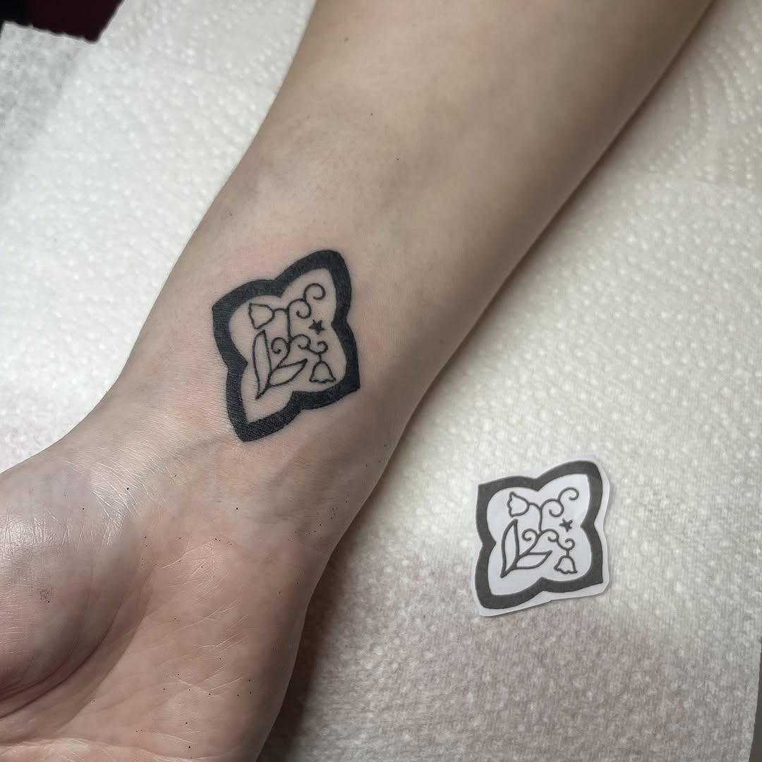 Hand-poked floral tile with protective, bold black outline