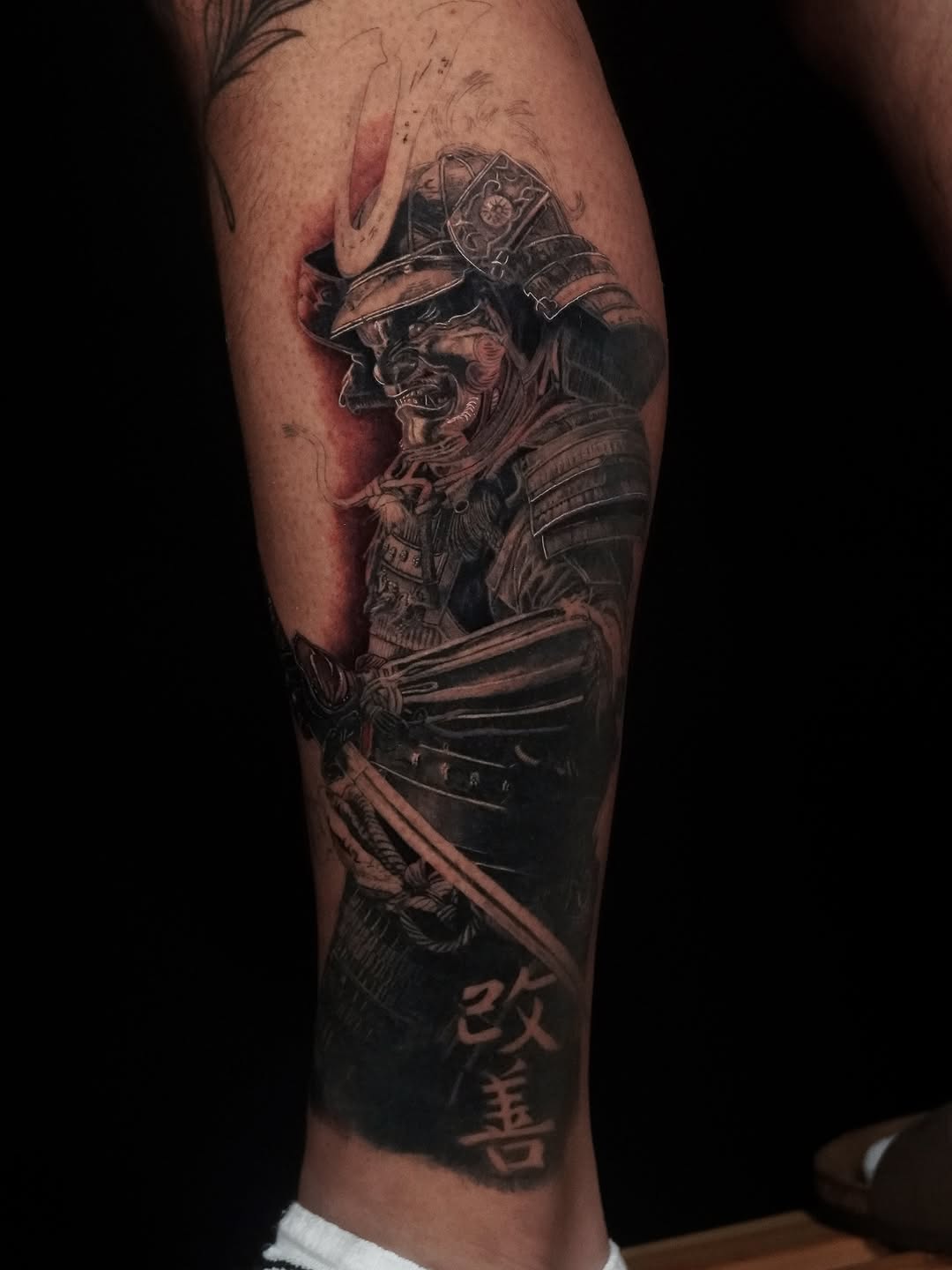 Intricate black-and-gray samurai armor, fiercely detailed.