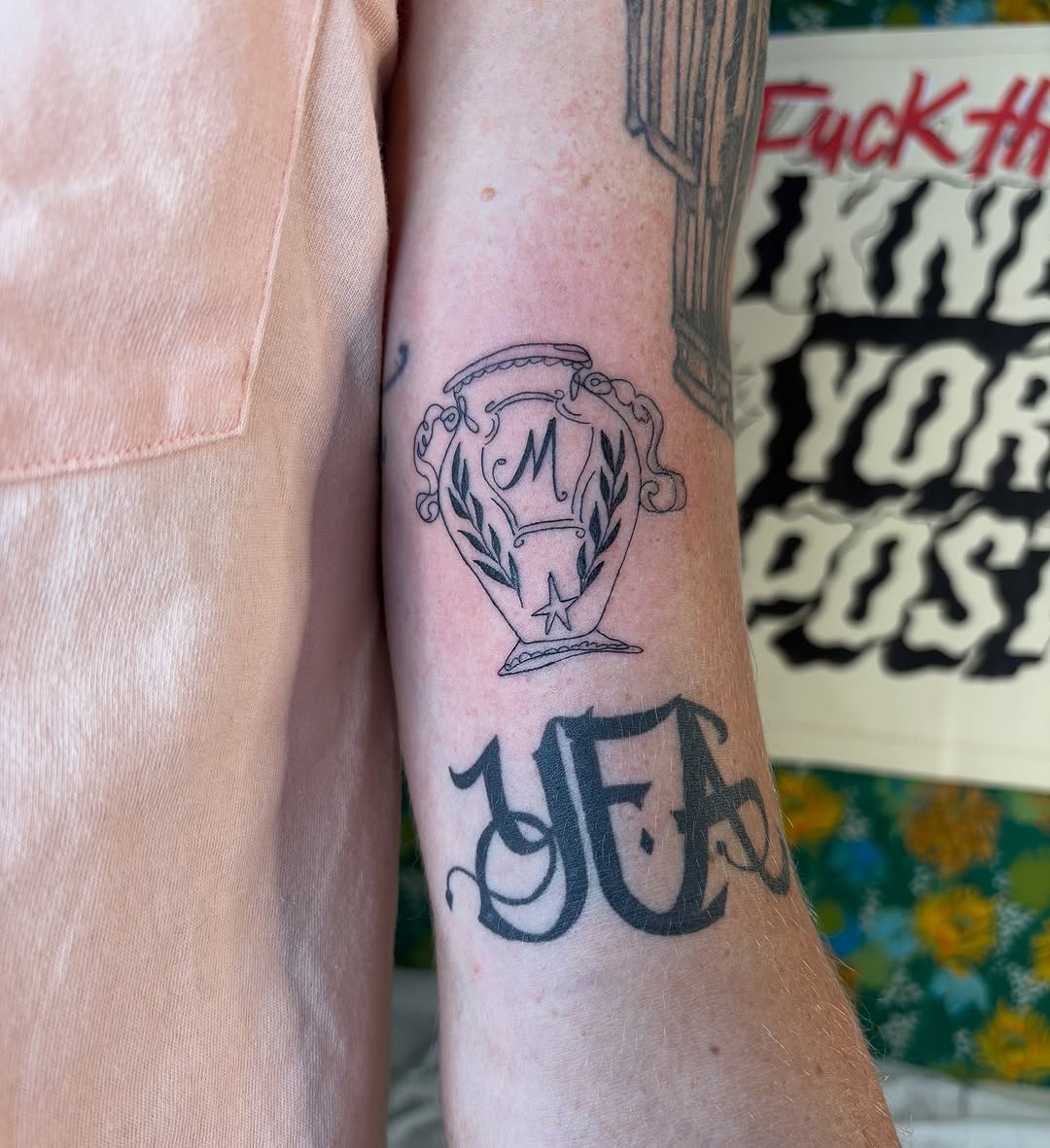 Urn tattoo with lettering