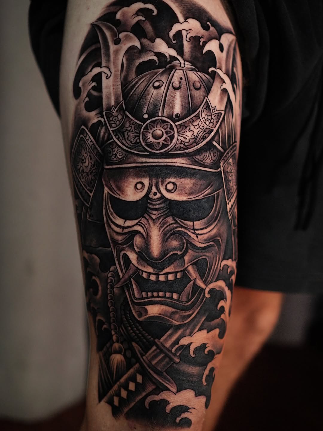 Bold black-and-gray Japanese oni mask with ornate crown