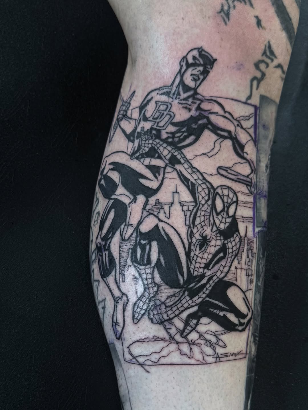 Dynamic black-line comic duel between Spider-Man and Daredevil over city