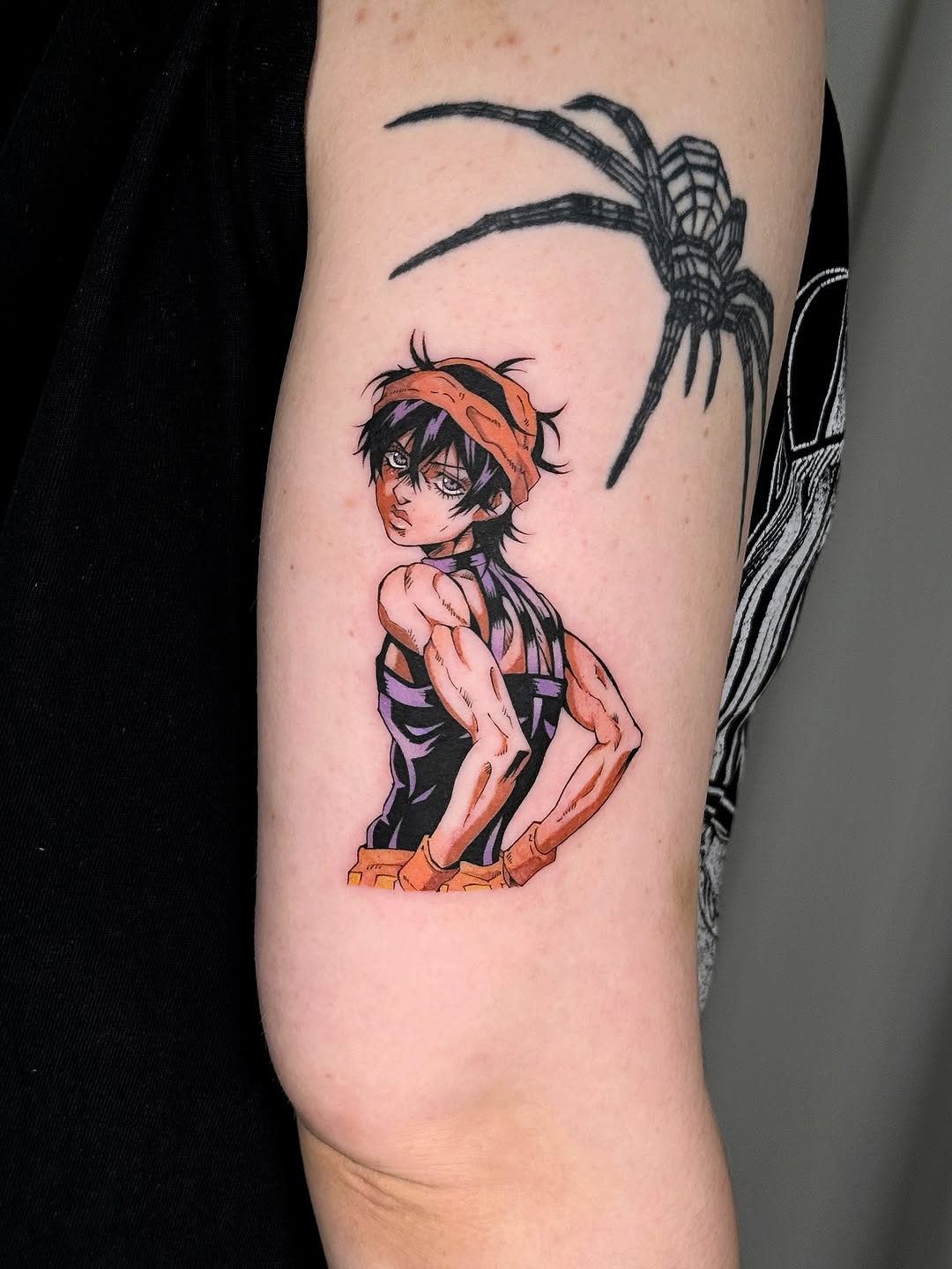 Bold anime hero with orange headband and spider motif