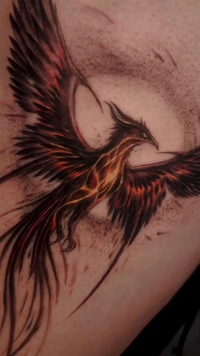 Fiery phoenix with bold linework and burning orange highlights