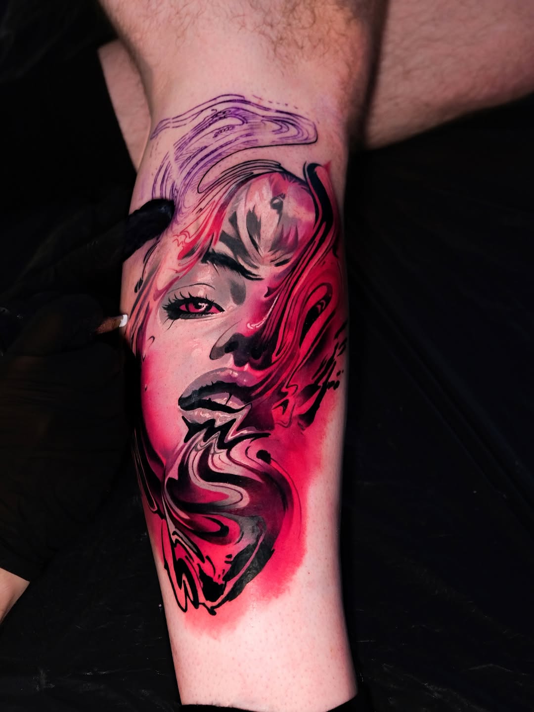 Vivid pink-and-black portrait with swirling, flowing hair