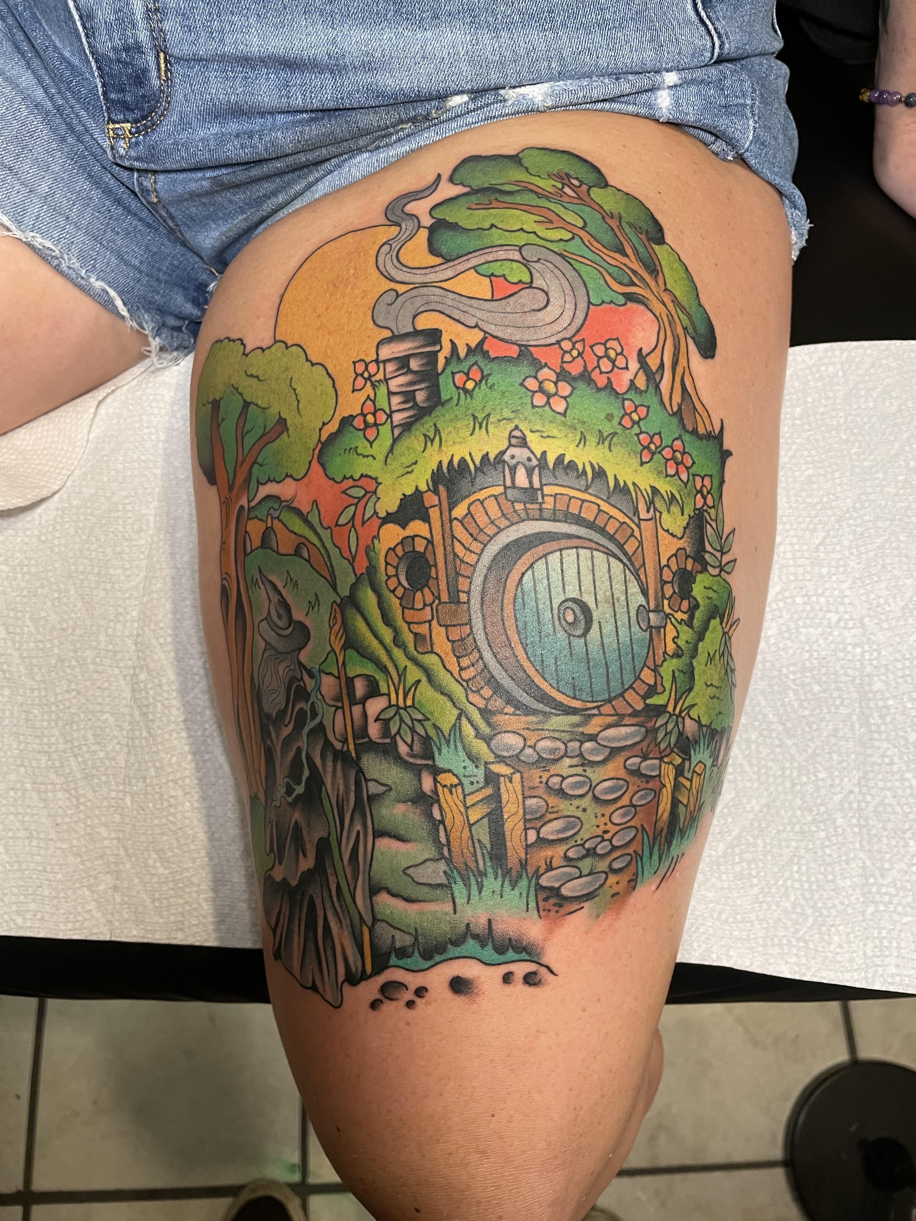 Colorful fantasy landscape with hobbit-hole door and lush garden