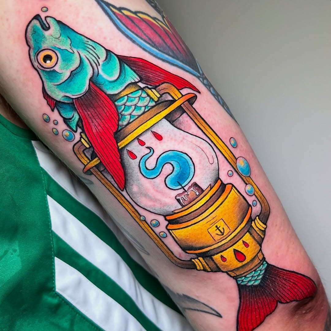 Bright neo-traditional fish emerging from a vintage lamp.