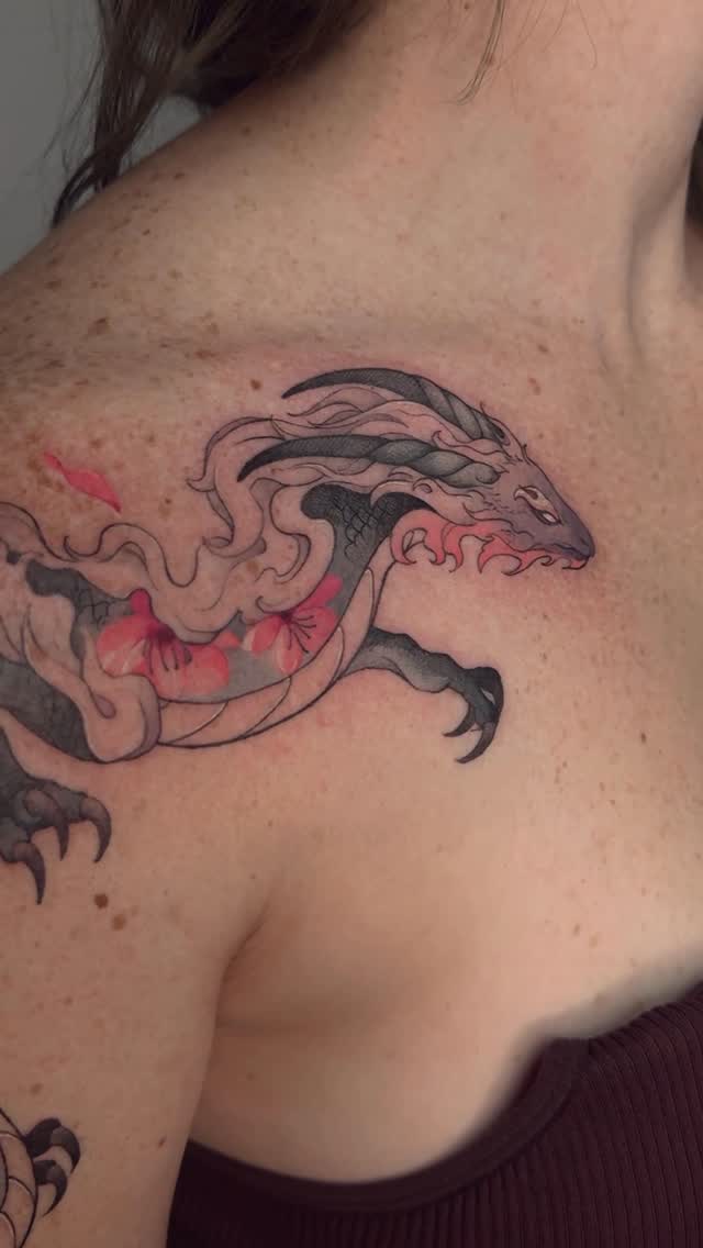 Sinuous Japanese dragon entwined with pink cherry blossoms, bold linework.