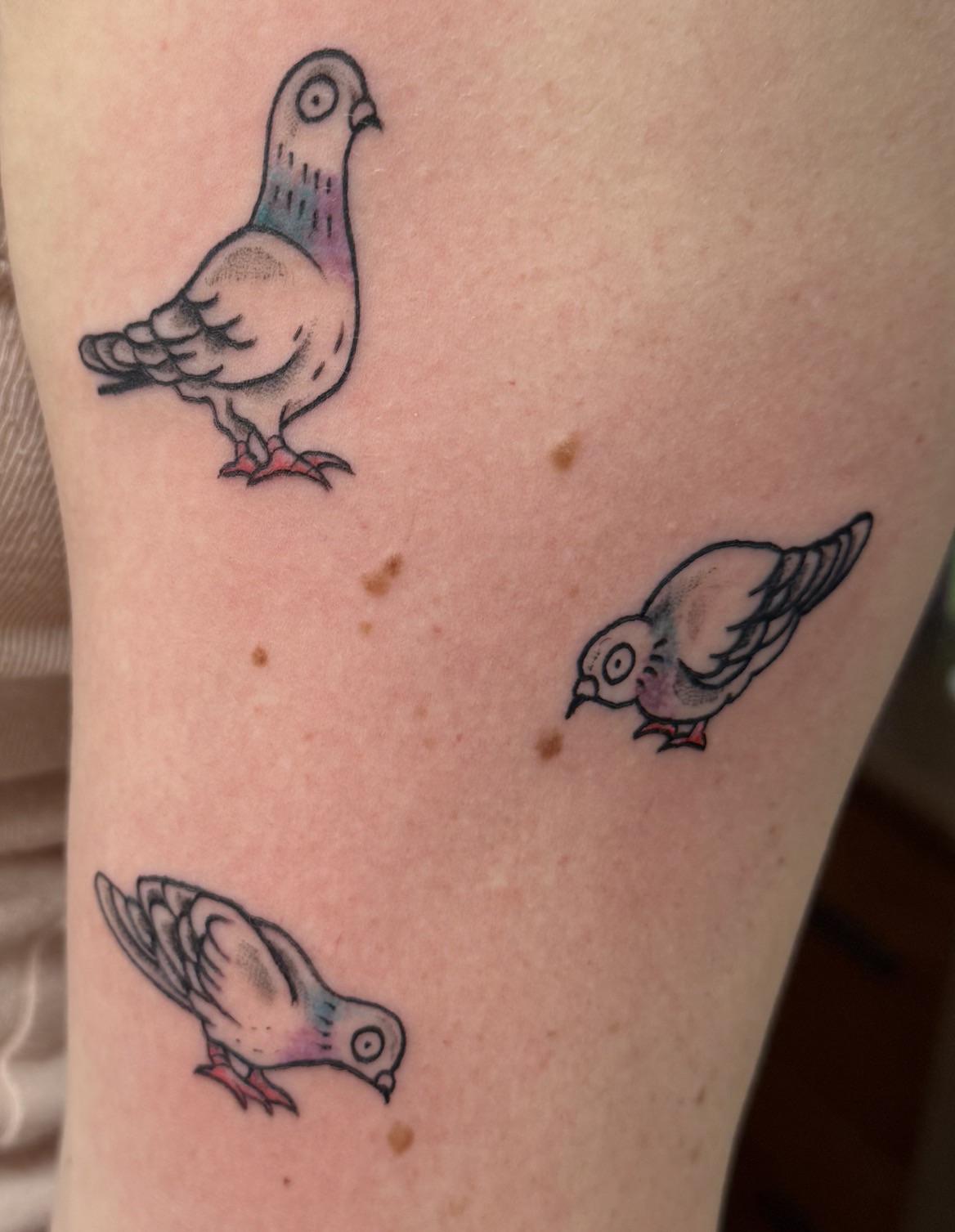 Three colorful bird tattoos