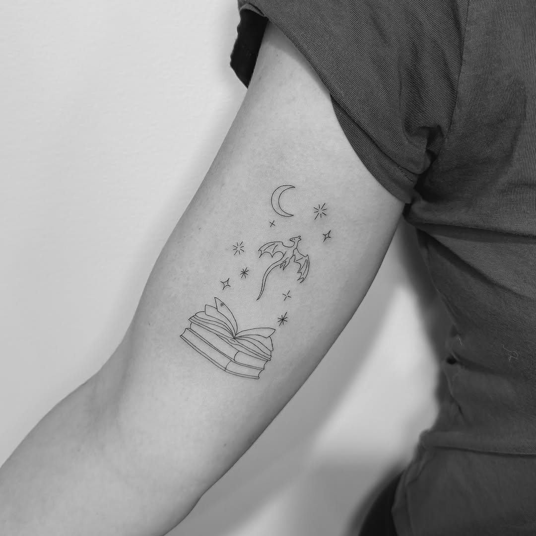 Delicate open-book scene with dragon, moon, stars