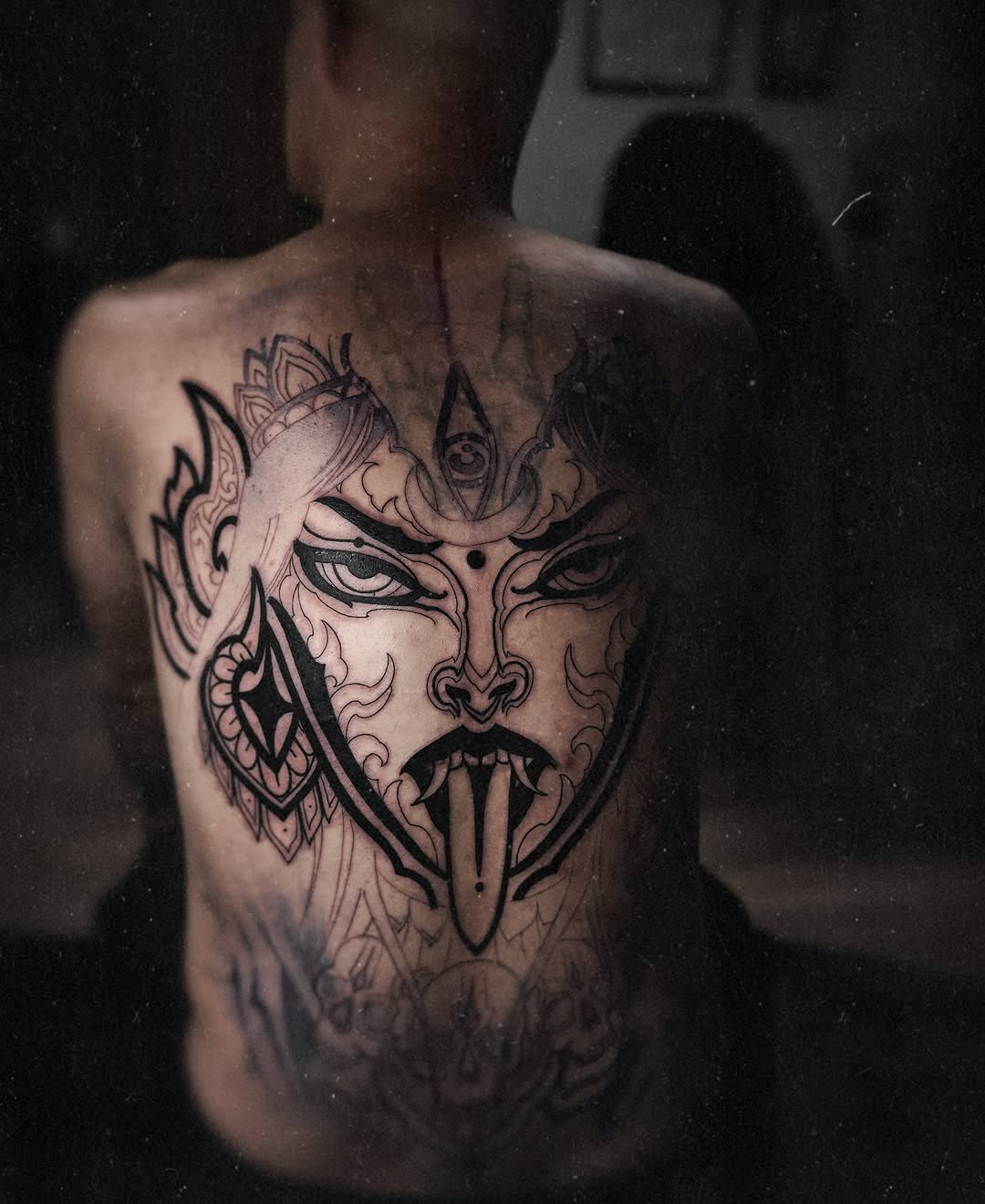 Monstrous Kali-inspired mask with ornate linework