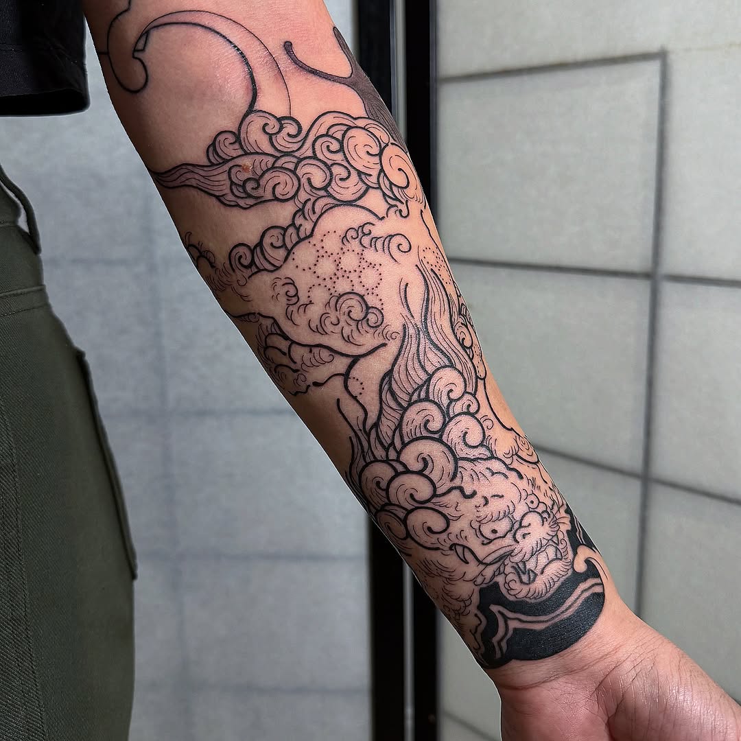 Japanese-inspired cloud-and-wave forearm sleeve with bold fineline