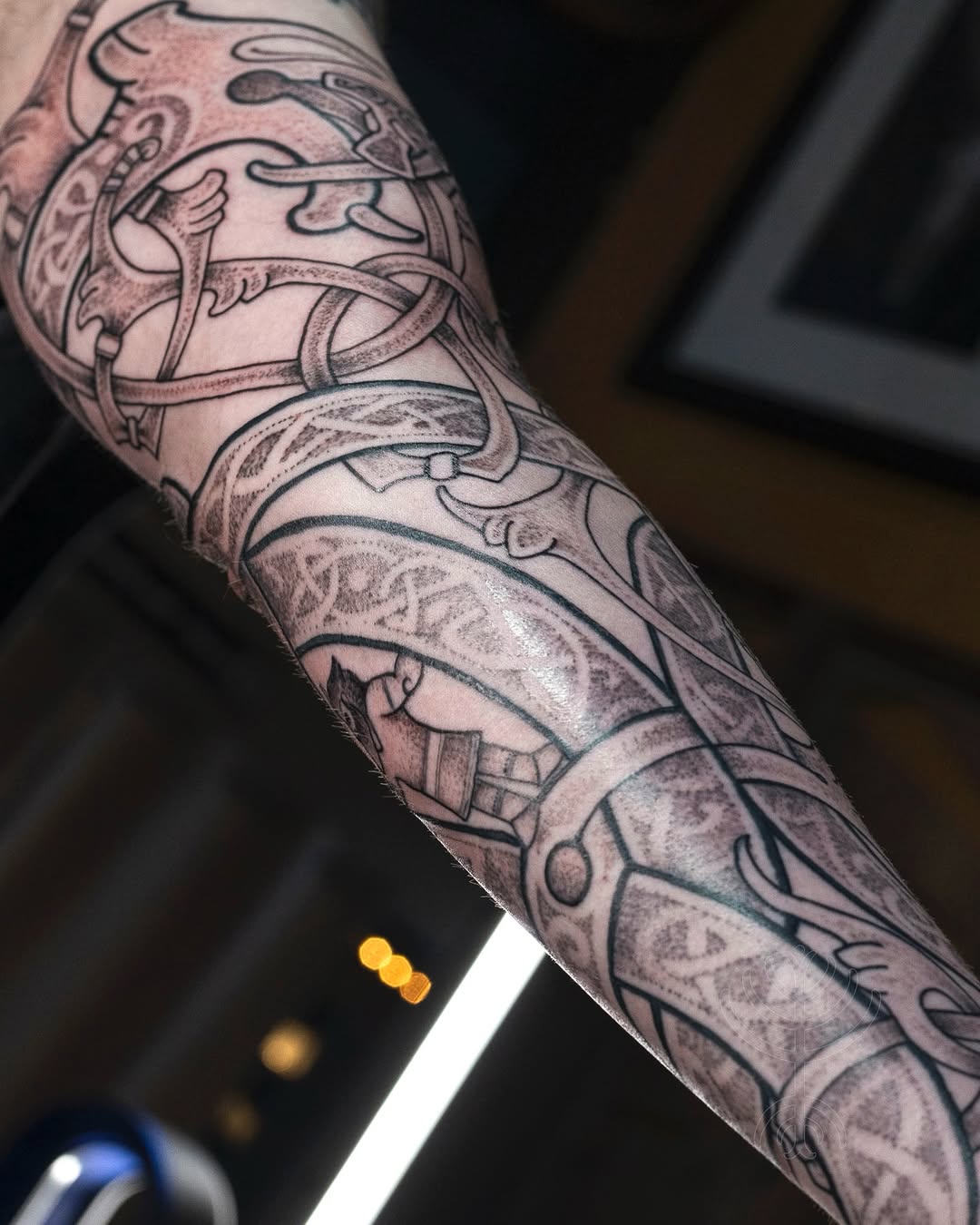 Nordic knotwork sleeve with interlacing ribbons and shading