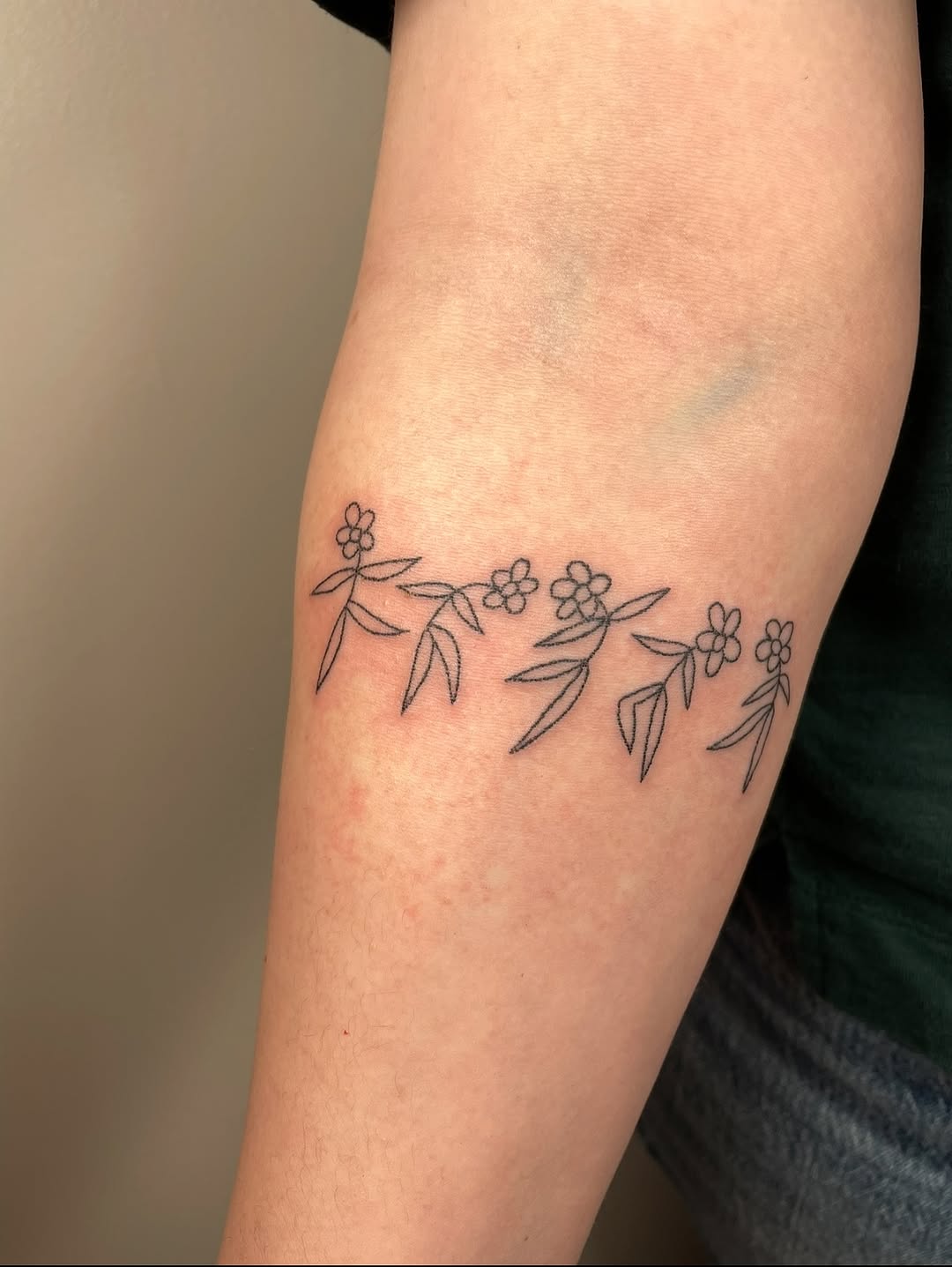 Dancing flowers tattoo