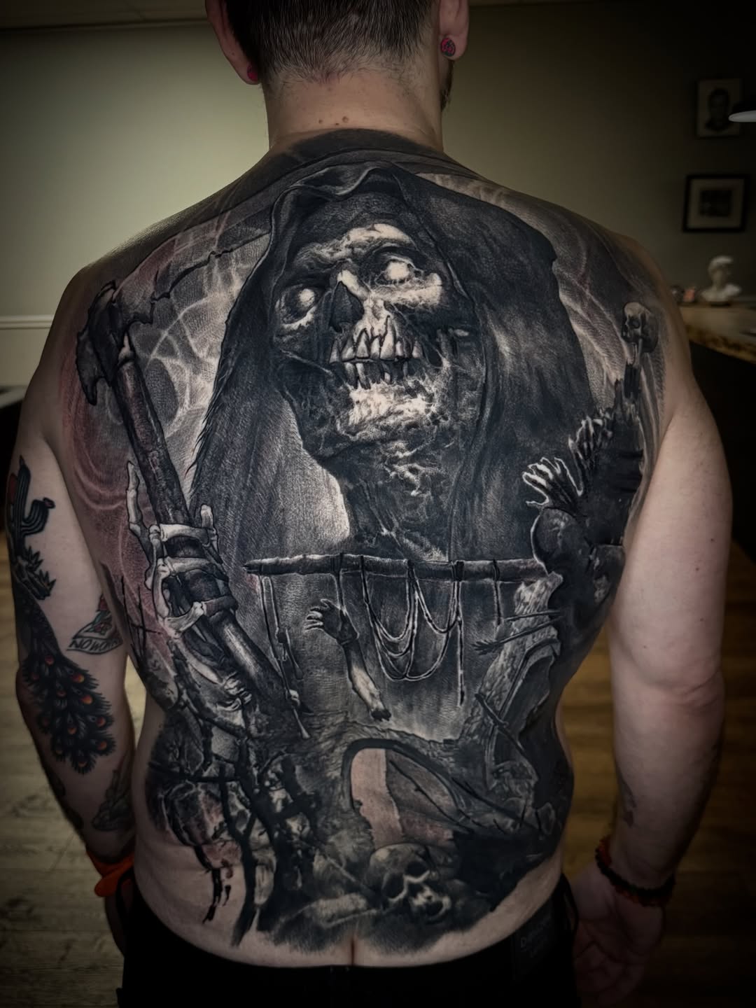 Monstrous grim-reaper backpiece with hooded skull and chains