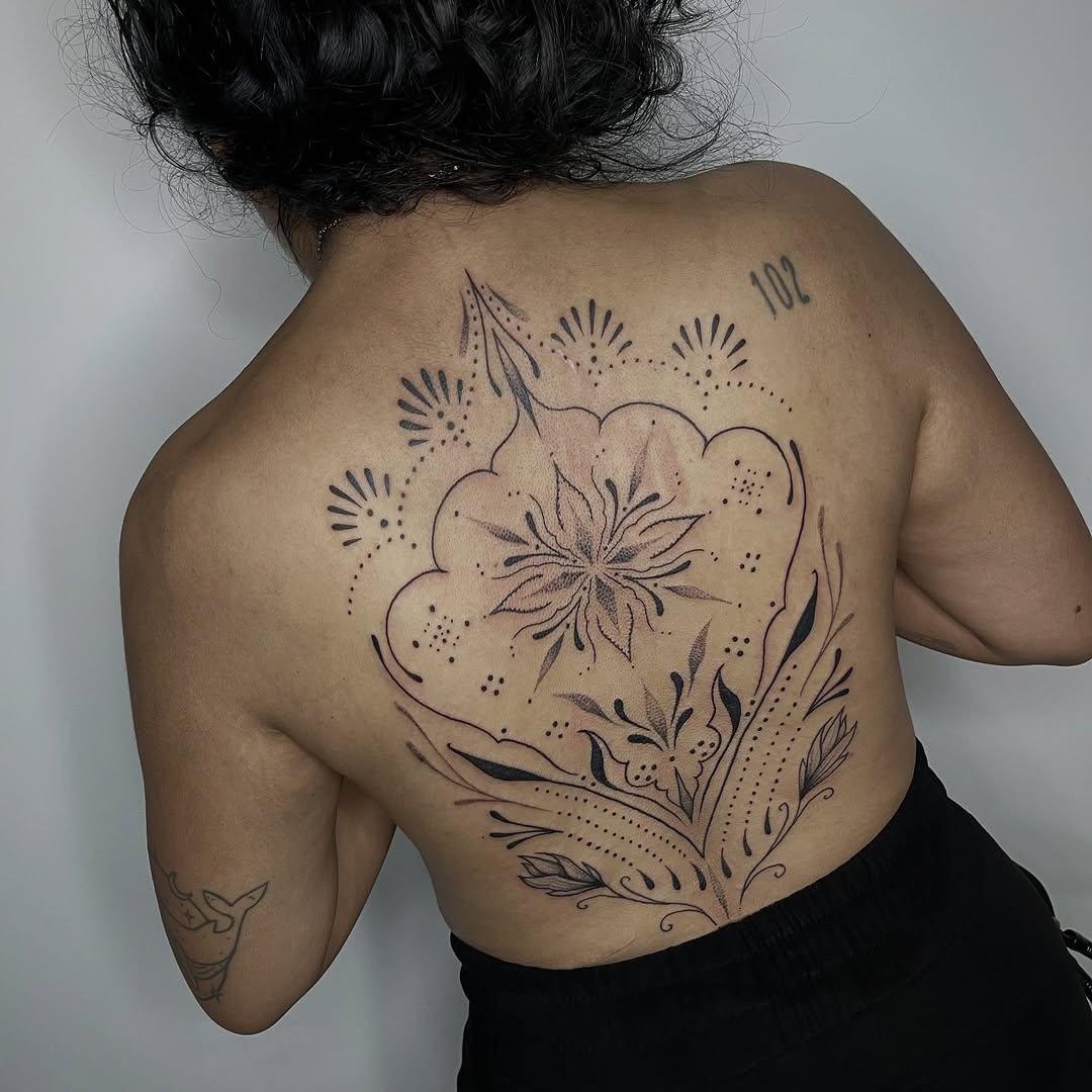 Intricate back floral mandala with blackwork linework