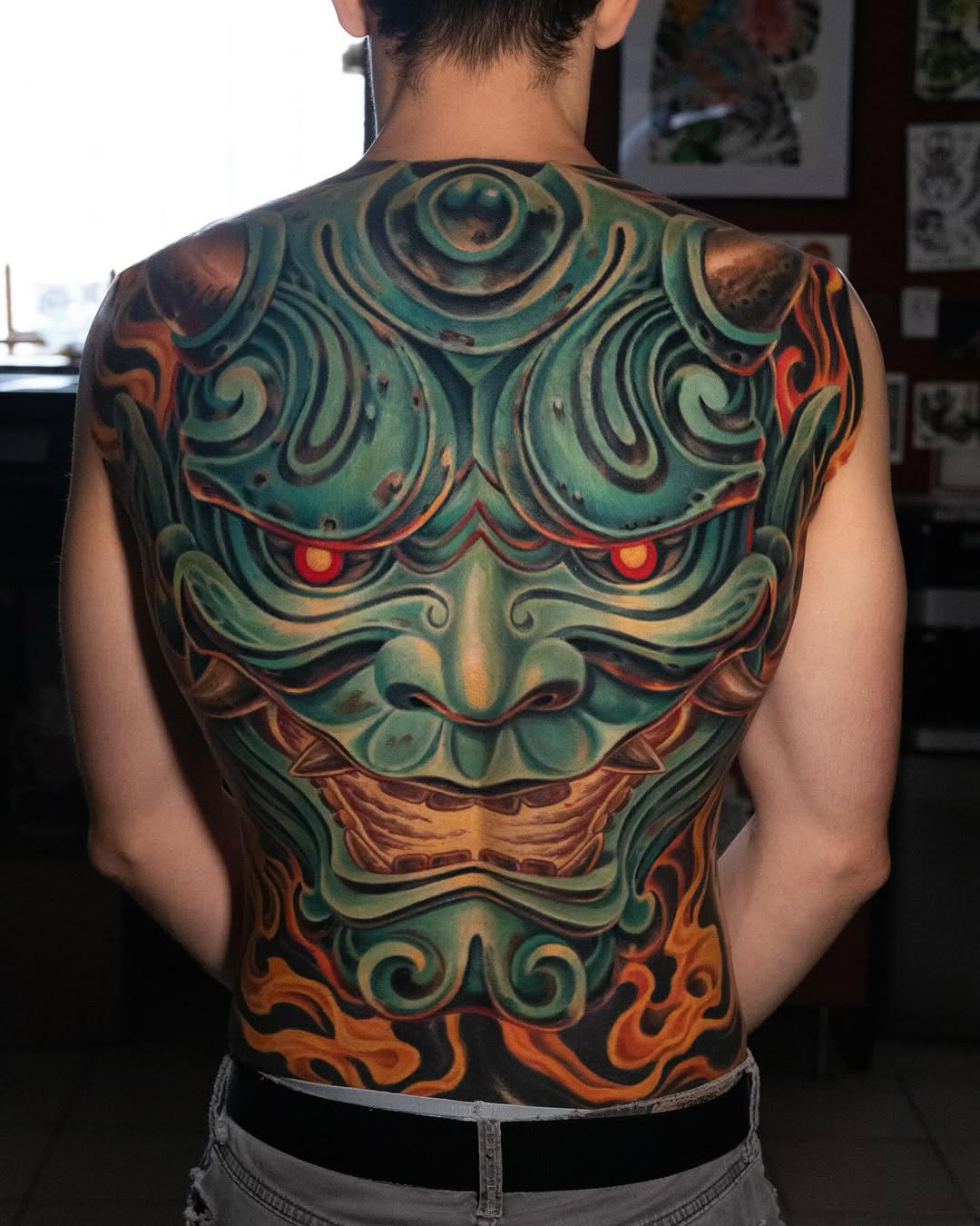 Vibrant Hannya back piece with swirling teal jade and fiery accents
