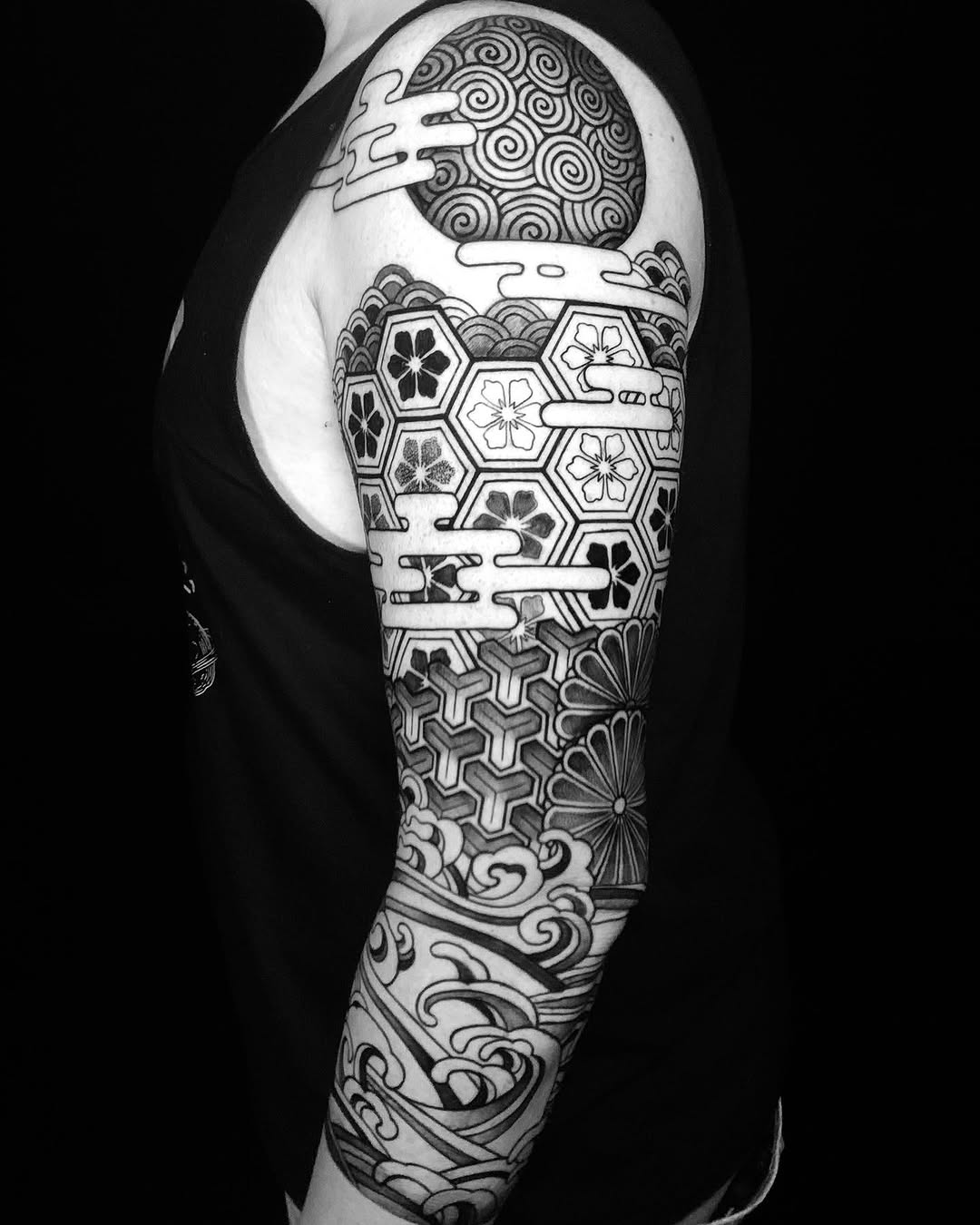 Bold Japanese geometric sleeve with hexagon kikko panels and sakura