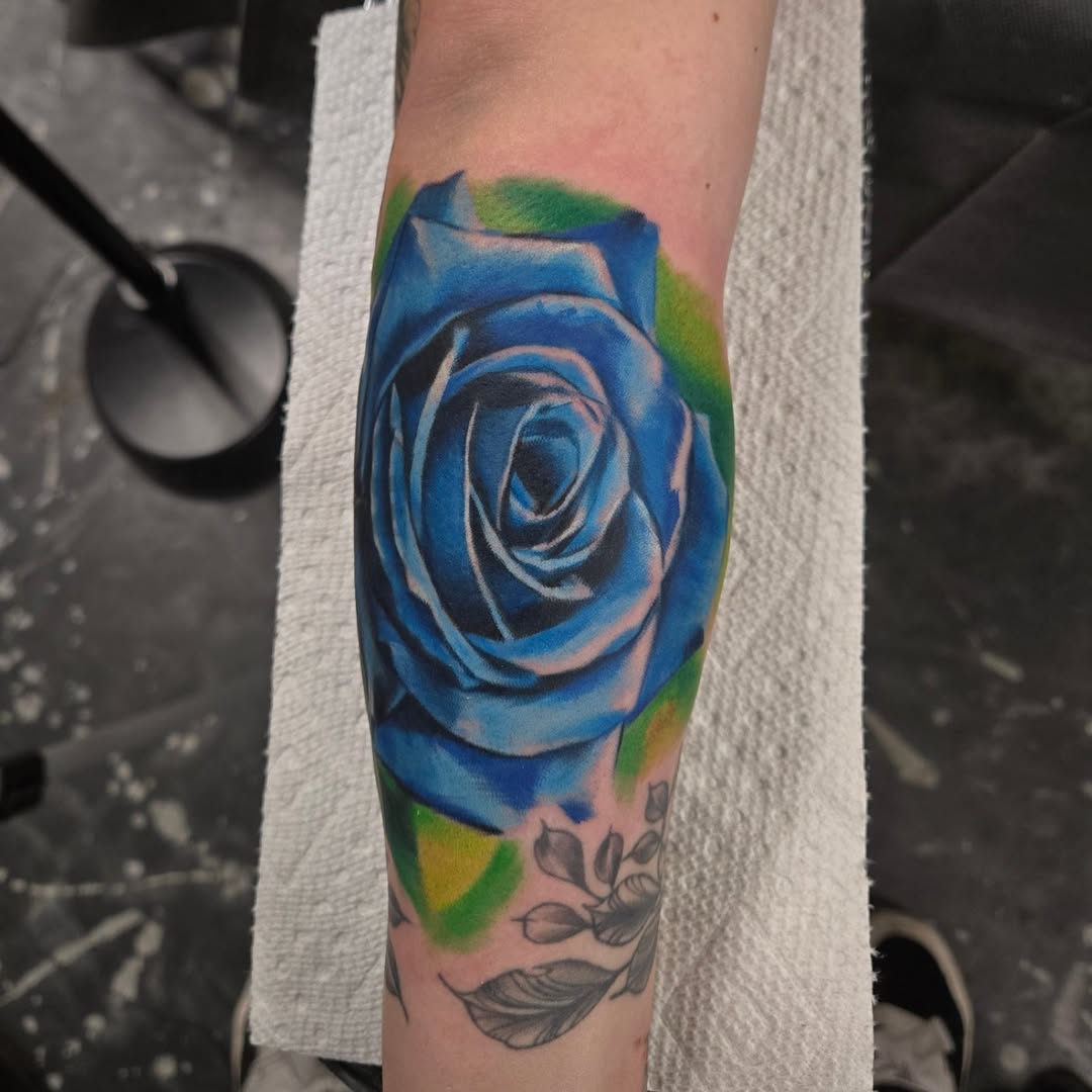 Vibrant blue rose, hyper-realistic shading with green halo.