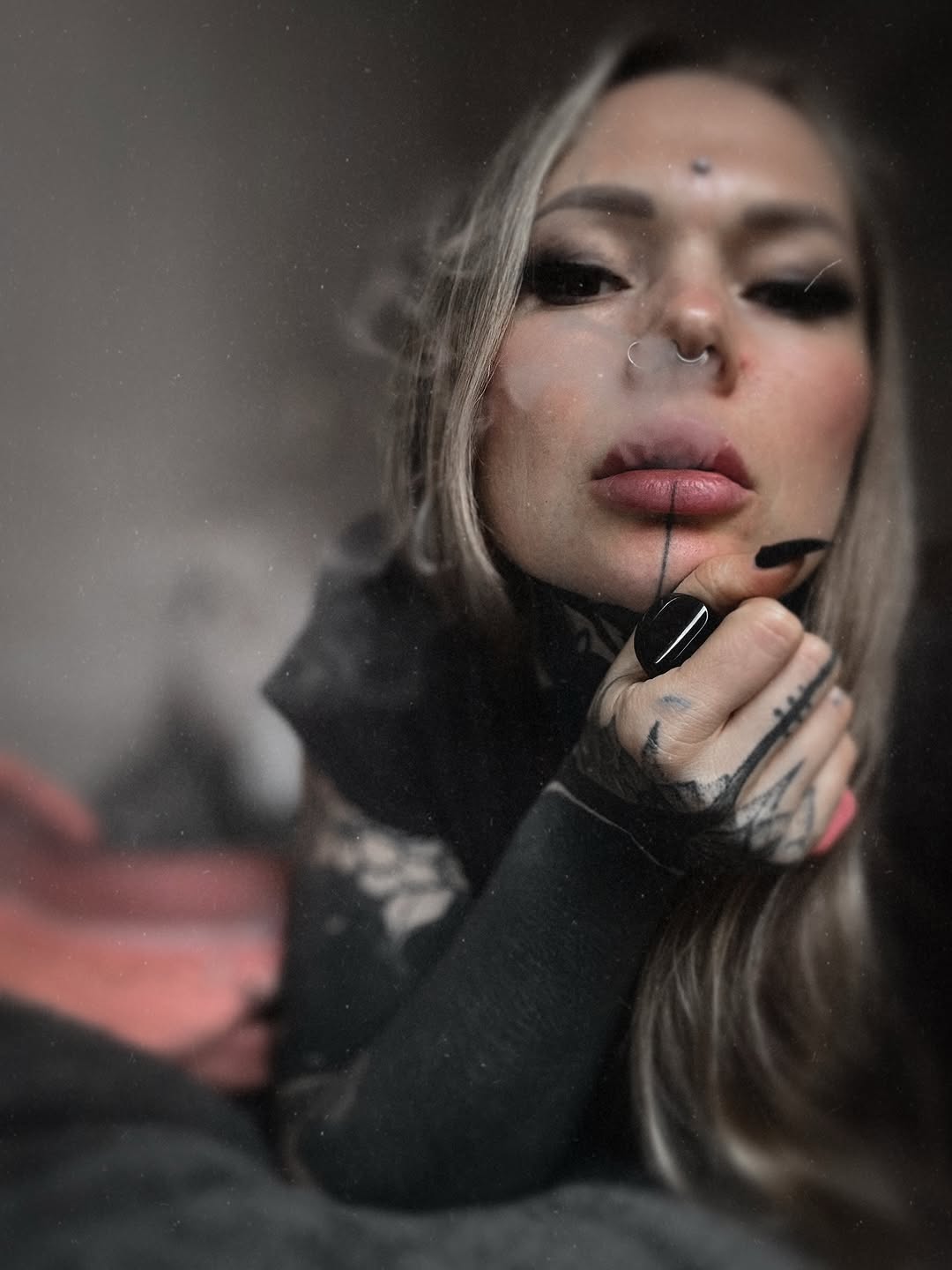 Delicate blackwork hand tattoos with lace-like lines