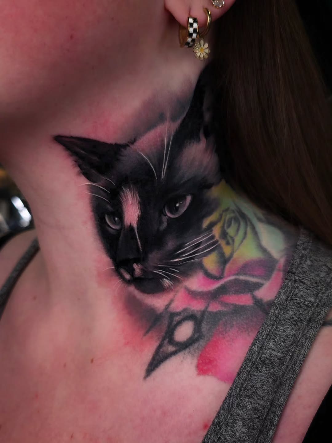 Photorealistic black cat head with pink wash backdrop