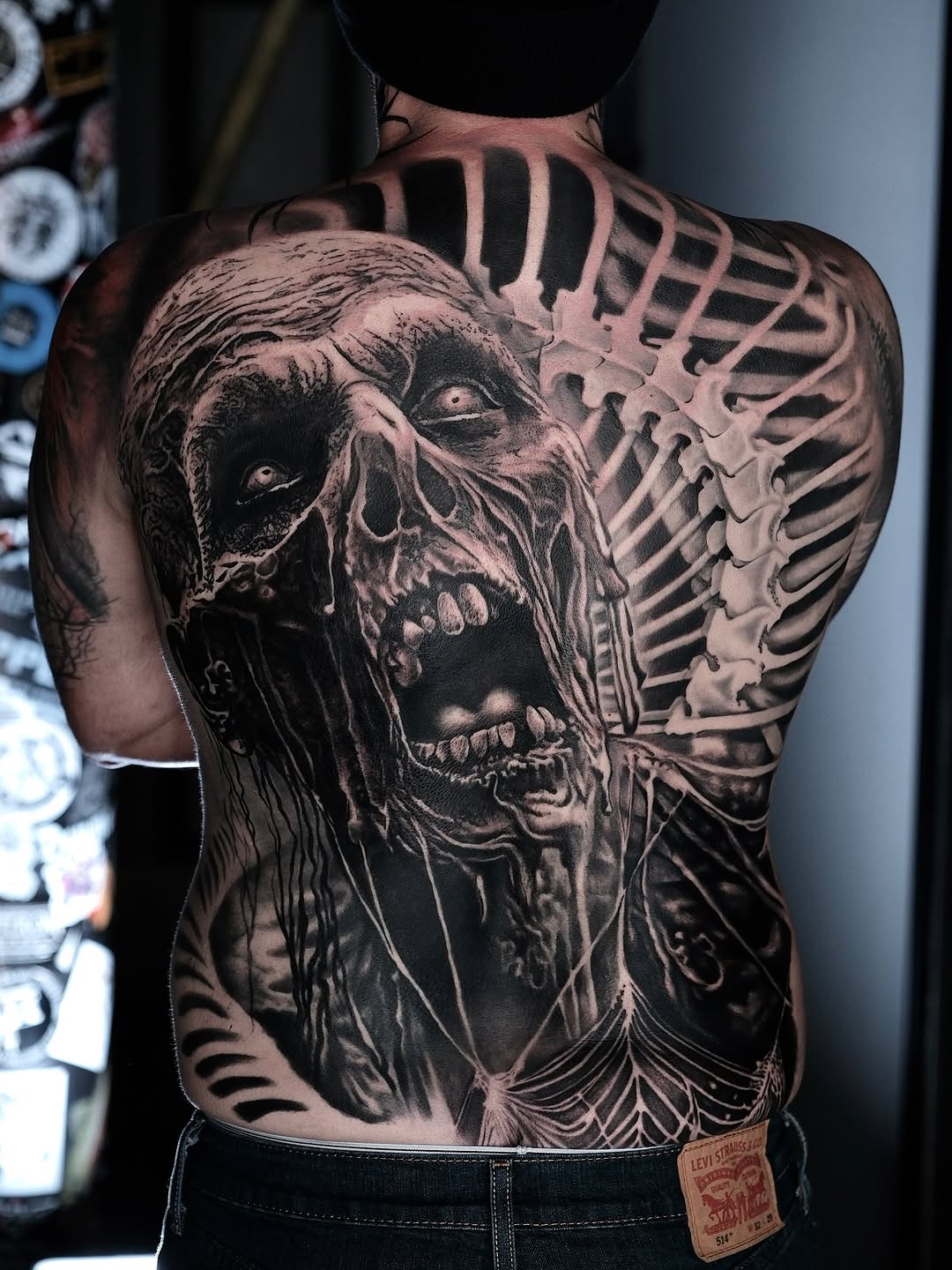 Chilling zombie scream emerges from detailed ribcage back piece