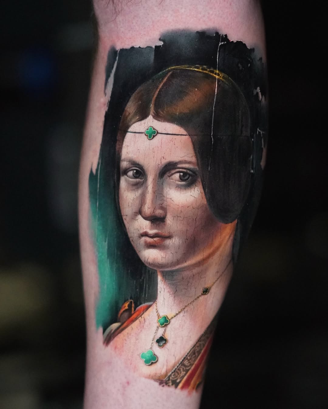 Renaissance-style portrait tattoo with green clover jewelry