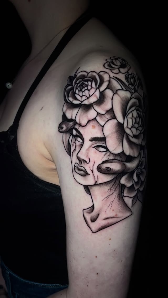 Monochrome surreal female head entwined with roses