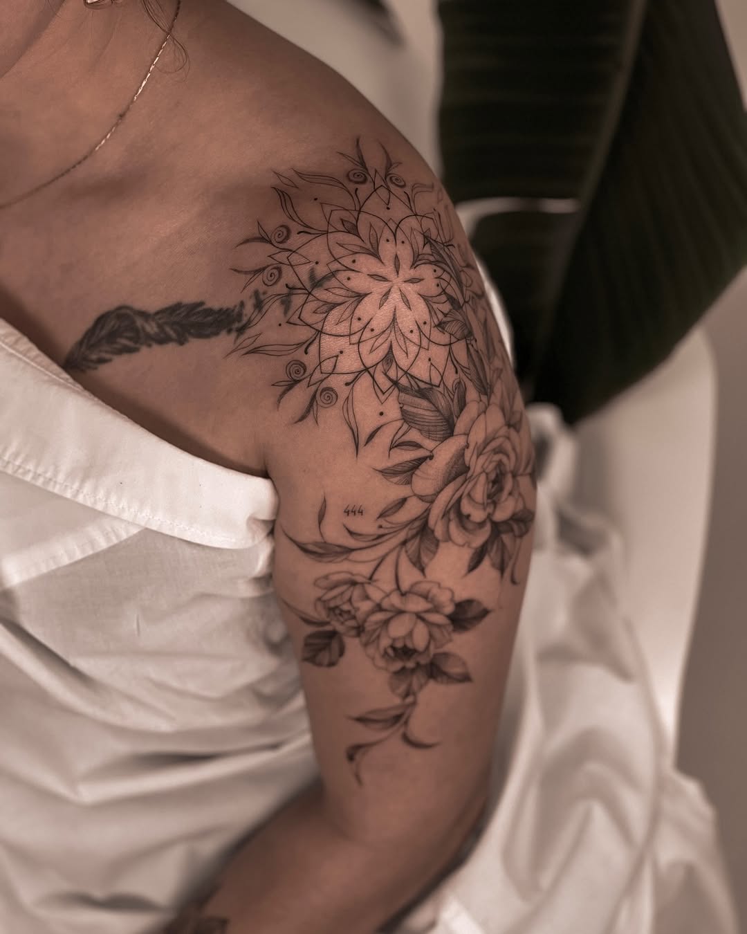 Intricate floral mandala with delicate fine-line petals.