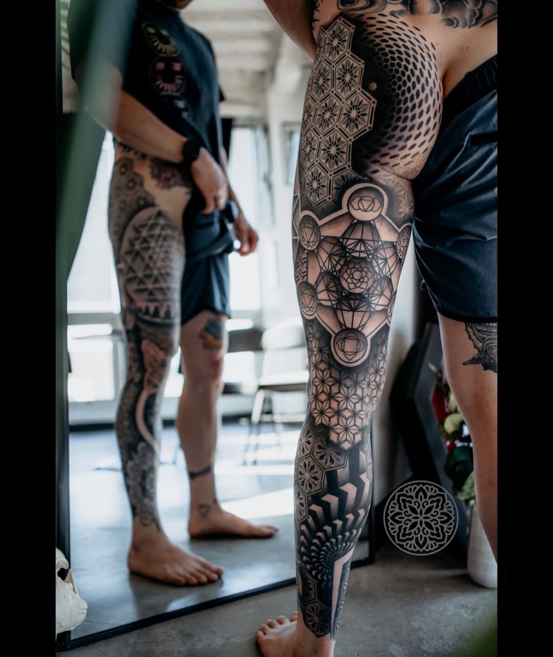 Intricate geometric dotwork leg sleeve with mandala motifs