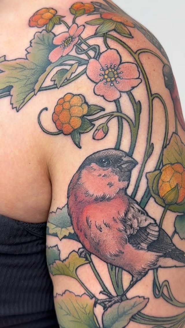 Vibrant bullfinch entwined with bold florals and vines