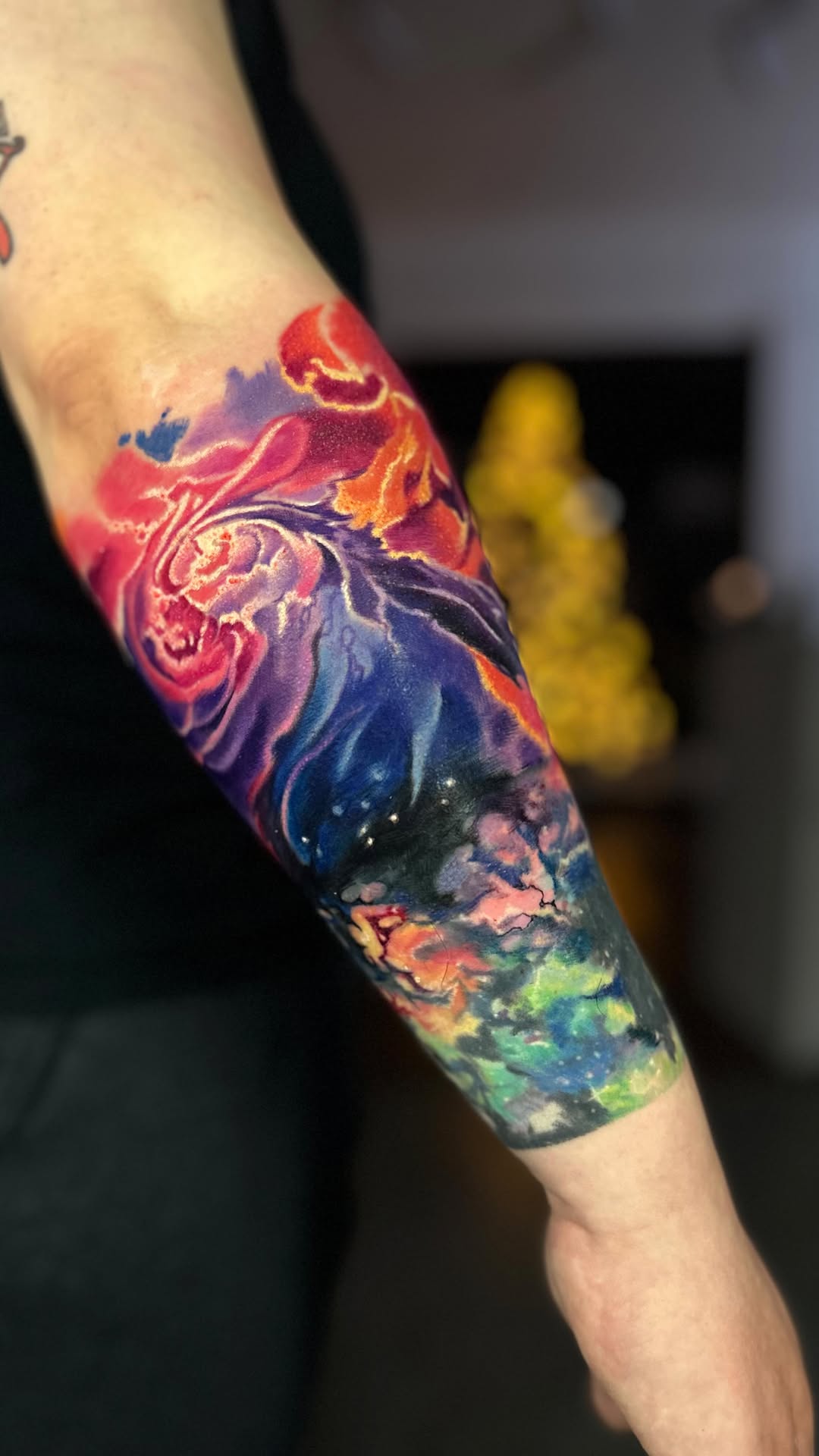 Vibrant watercolor cosmos sleeve with swirling nebulae