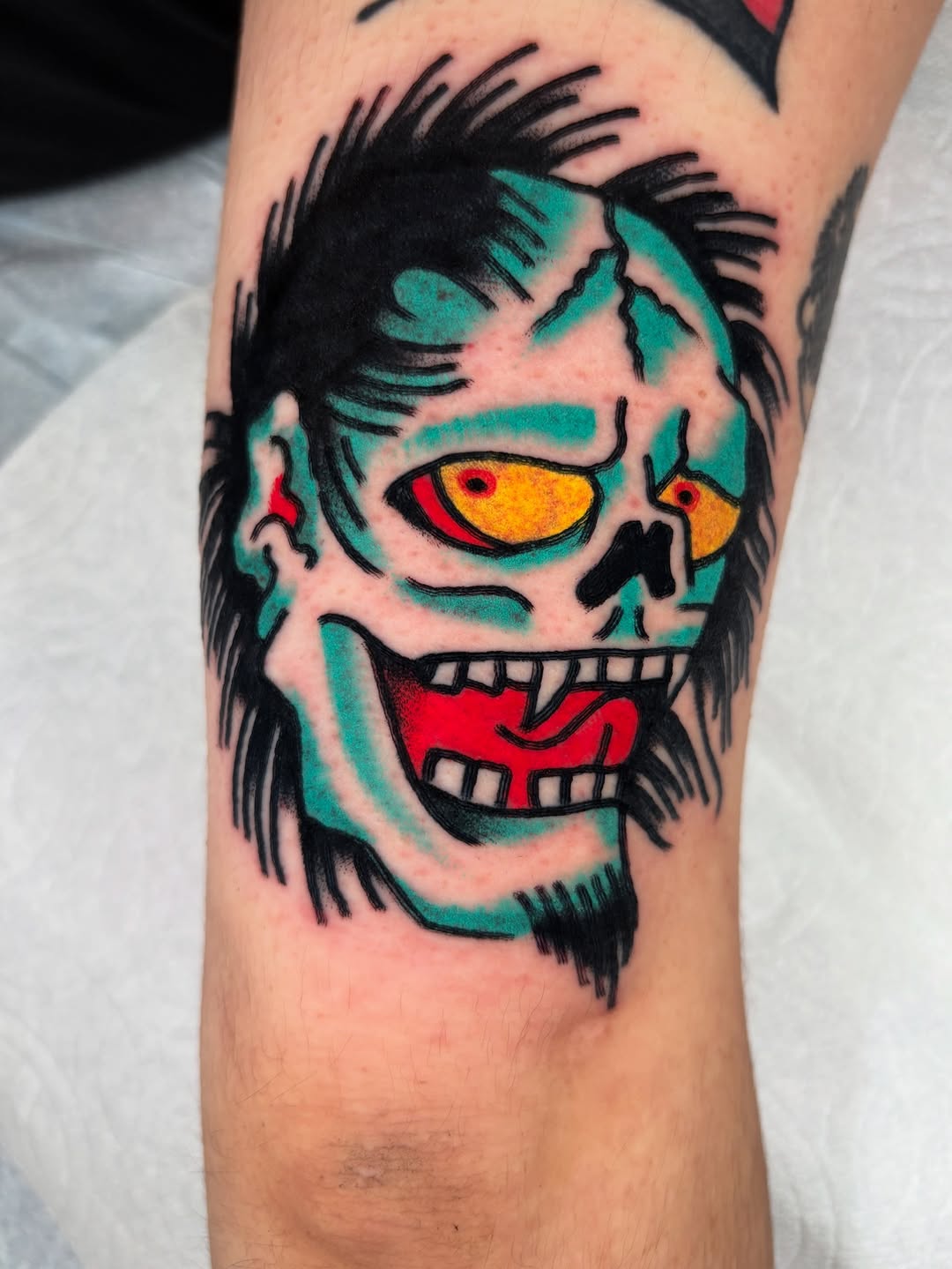 Grotesque neon clown head with teal shading and bold outlines