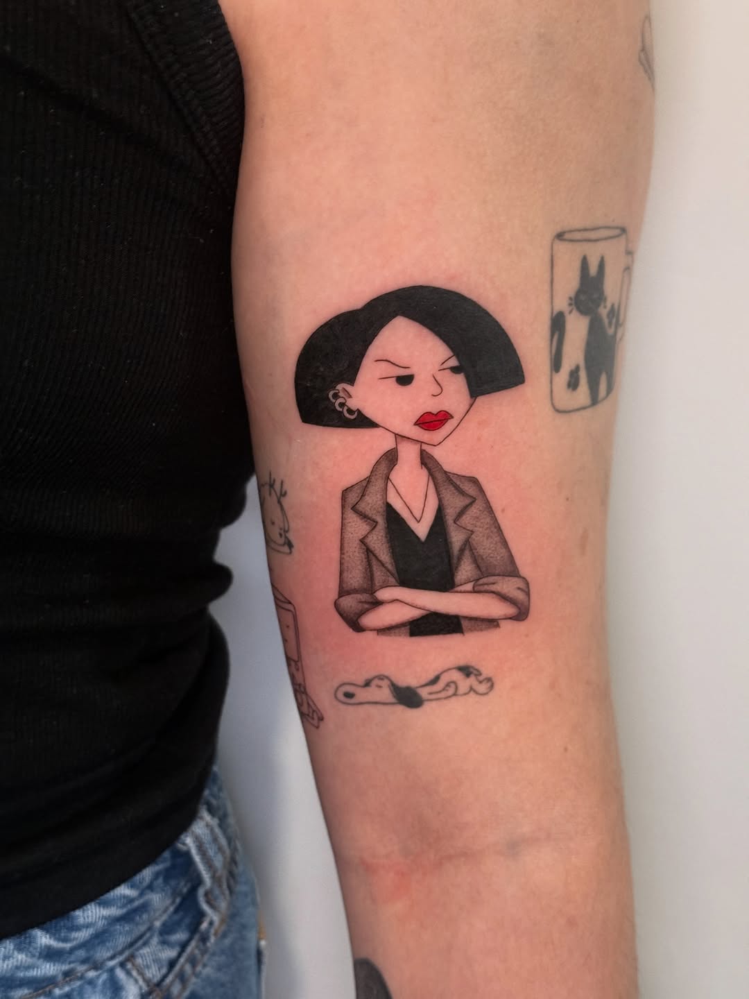 Stylized cartoon woman with sharp bob and blazer