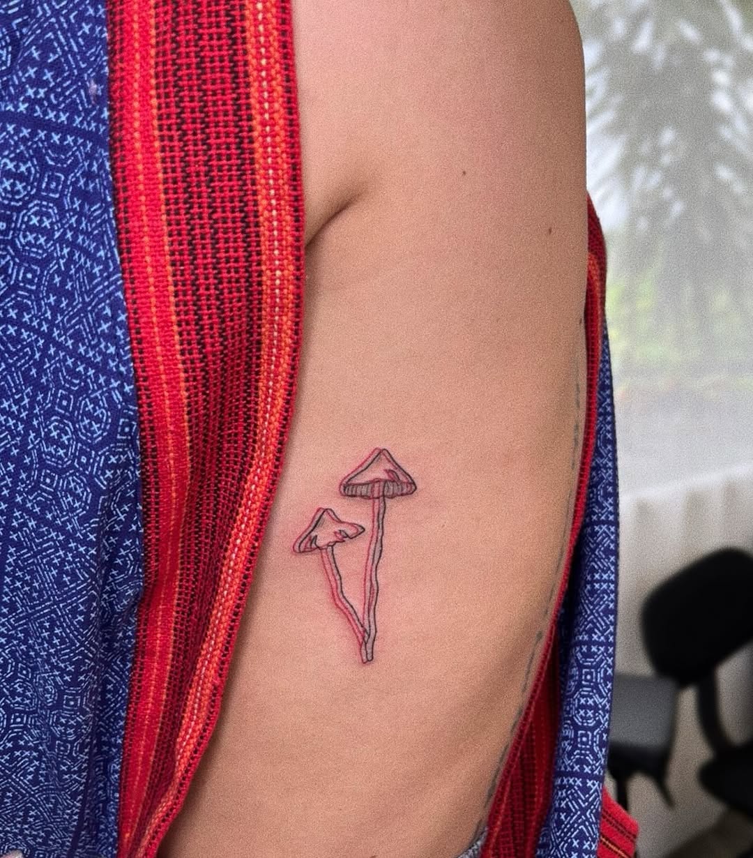 Minimalist line-drawn mushrooms with delicate pink shading.