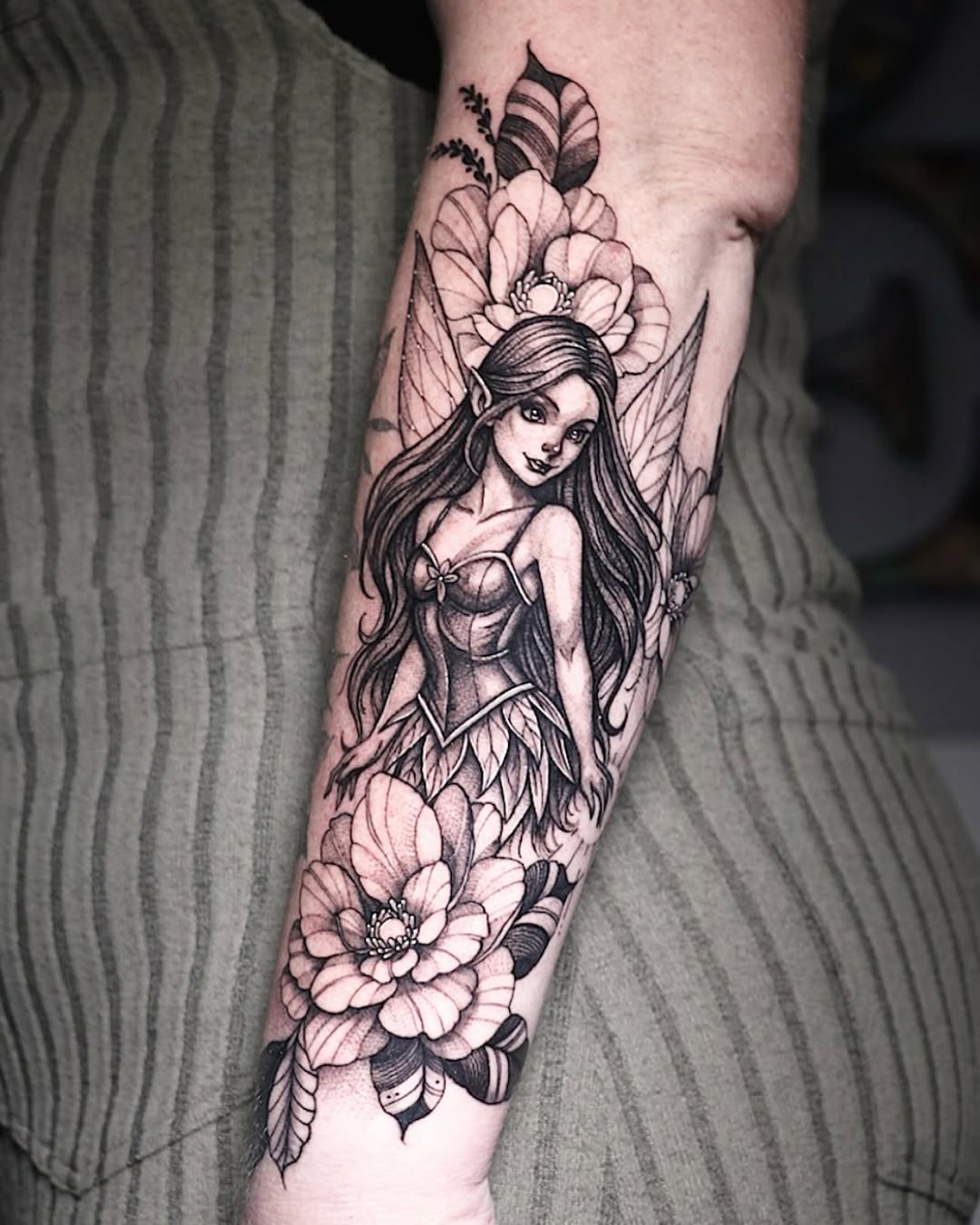 Whimsical fairy entwined with peony blossoms and foliage