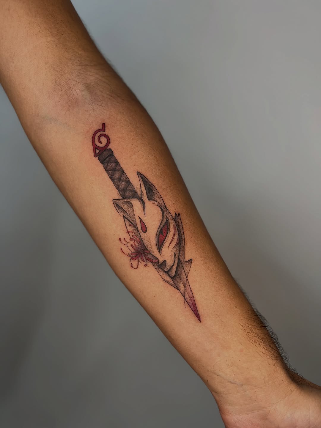 Kunai-inspired dagger piercing an oni-mask with crimson accents