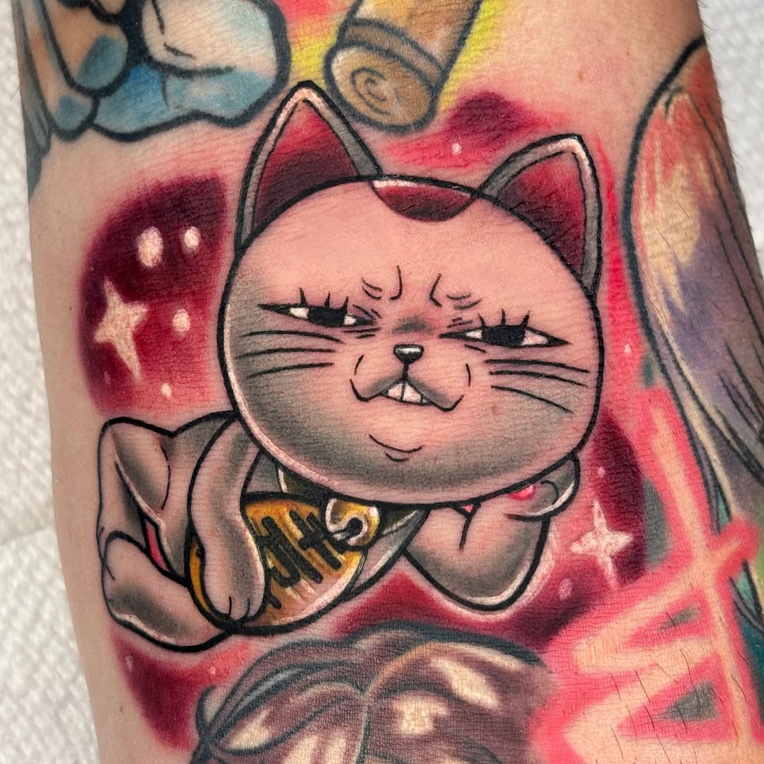 Playful chibi maneki-neko cat with cheeky grin.