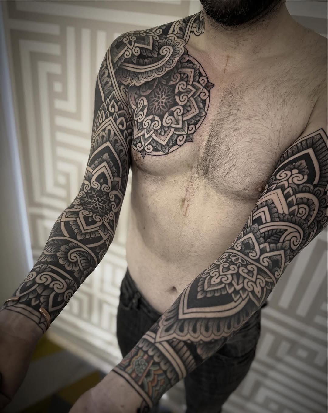 Intricate blackwork mandala sleeves with geometric motifs
