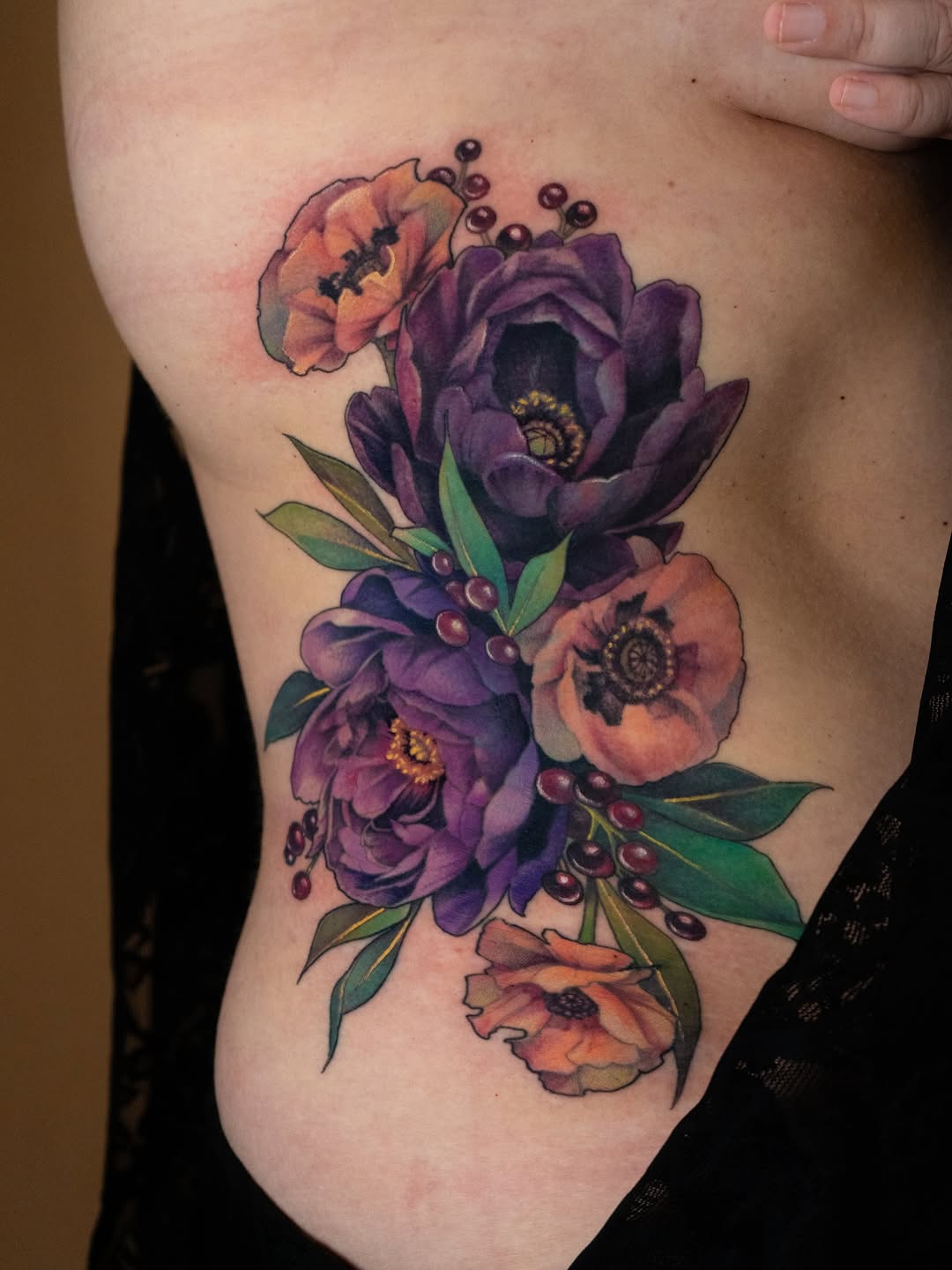 Vibrant floral bouquet with purple peonies and orange poppies