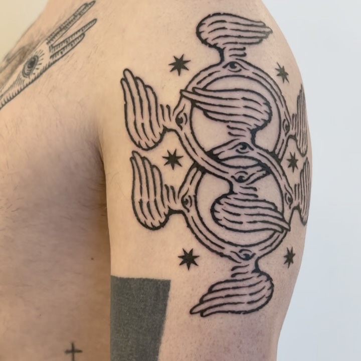 Intertwined celestial rings with eye motifs, stars, bold linework