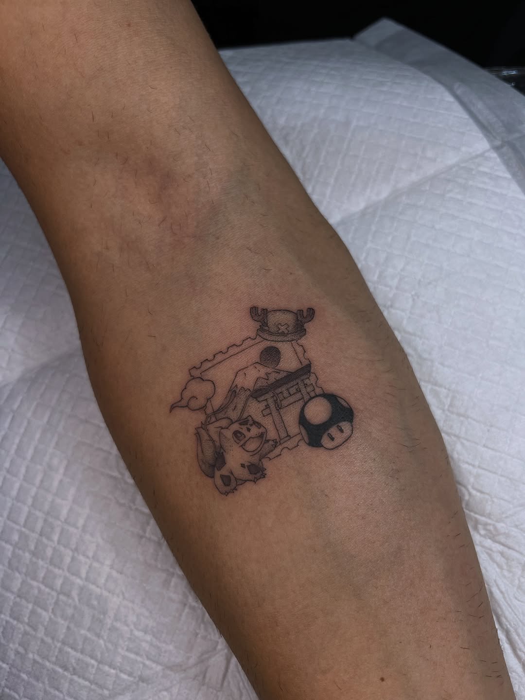 Playful Mario-inspired linework scene on the forearm