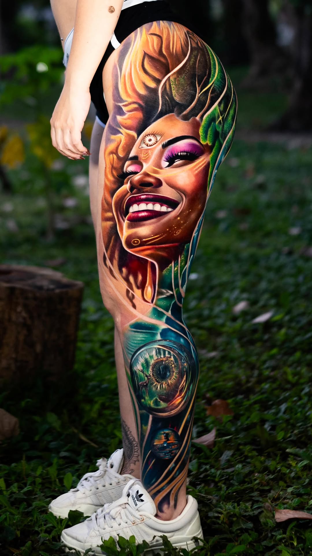 Vivid surreal leg-sleeve portrait of a radiant woman