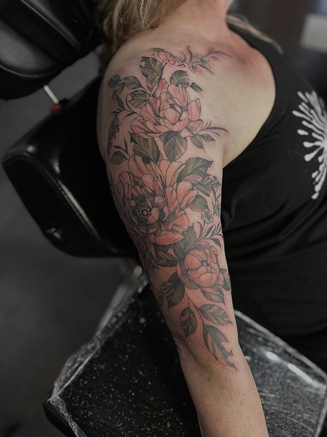 Delicate pink floral sleeve with bold linework and leaves