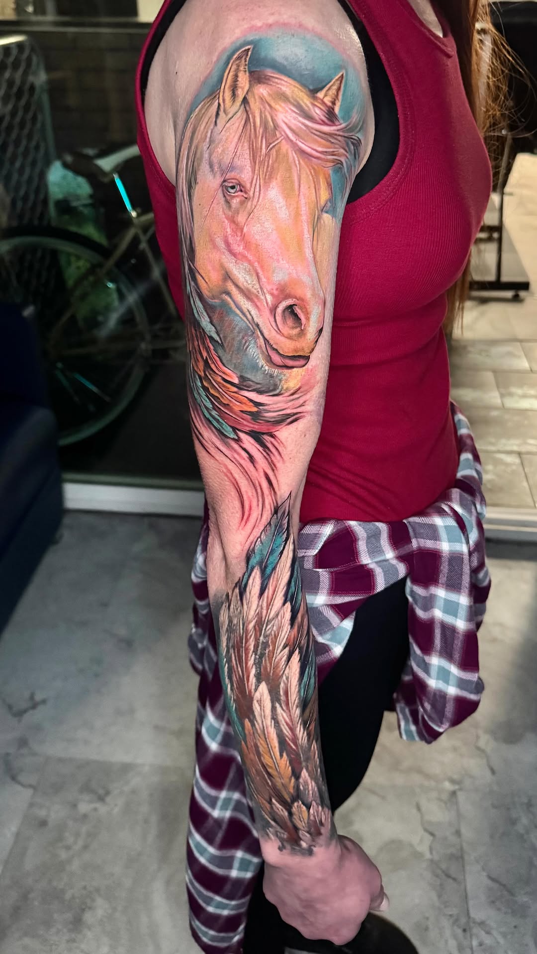 Vibrant watercolor horse portrait with flowing mane and feathers