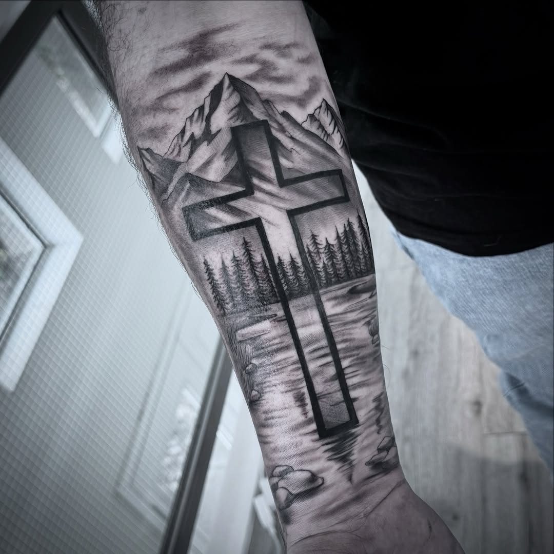 Bold cross silhouette over grayscale mountains and pines