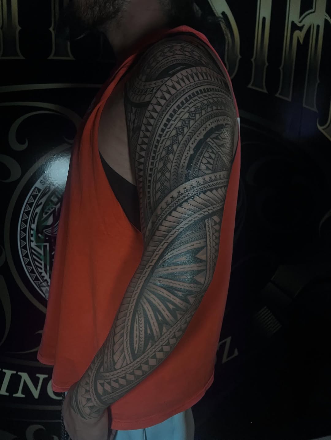 Bold Polynesian-geometric sleeve with intricate tribal motifs