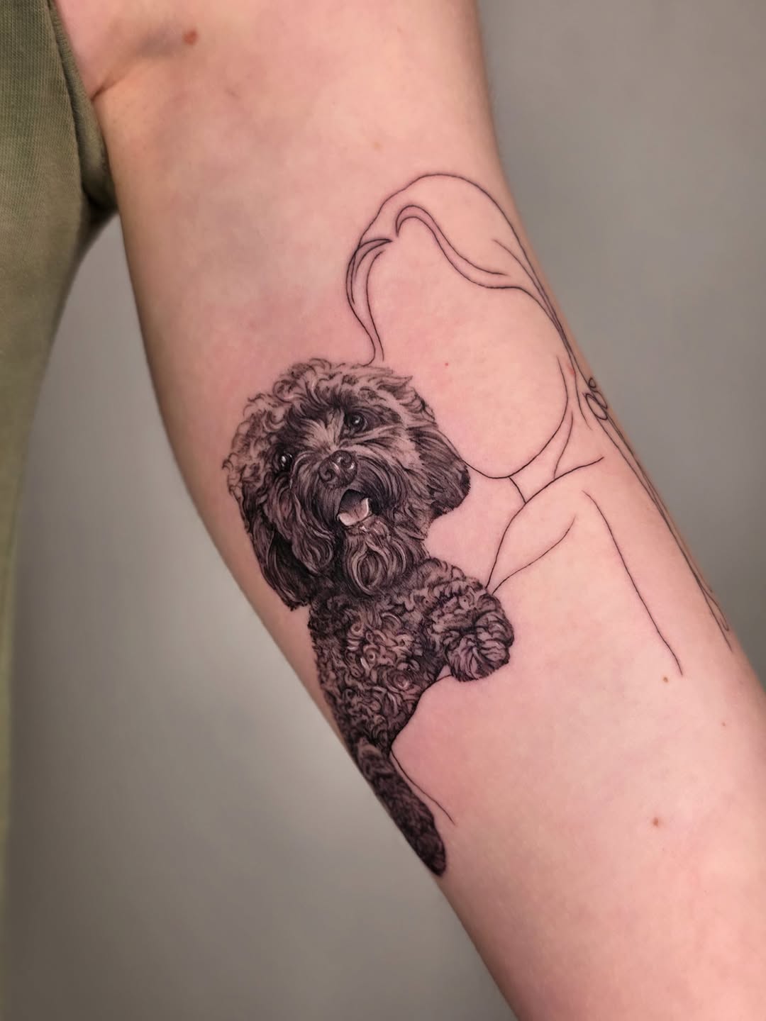 Lifelike black-and-gray poodle portrait with curly fur.